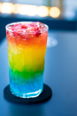 barbados cocktail, with rainbow colors and various flavors. Rum, orange, lime, sugar