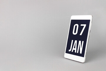 January 7th. Day 7 of month, Calendar date. Smartphone with calendar day, calendar display on your smartphone. Winter month, day of the year concept.