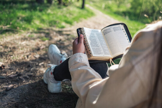 Girl with the Bible in nature. beautiful christian picture