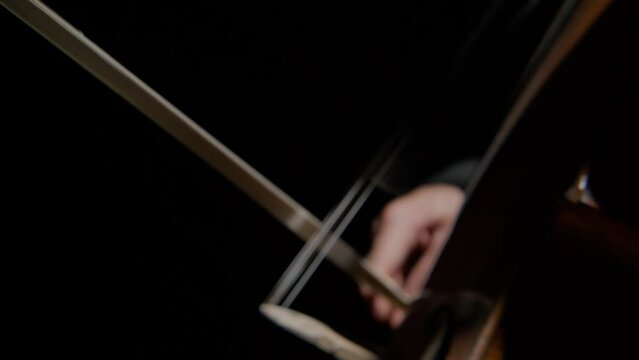 Cello in orchestra. Musician playing Cello