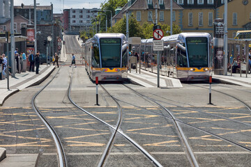 Ireland - Dublin - Two trams stop at the station Heuston of Dublin LUAS tramway red line