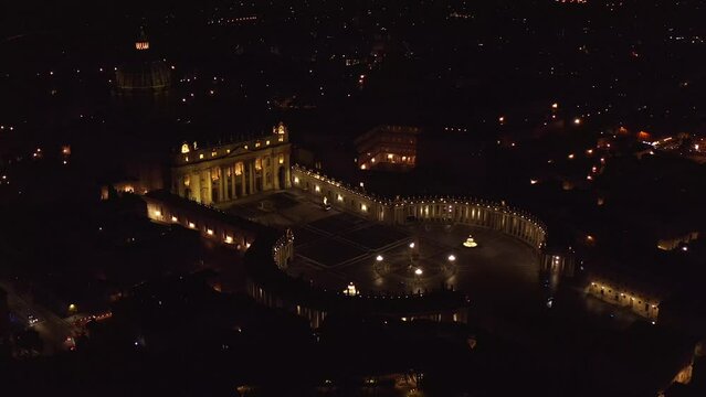 Aerial night view of Papal Basilica of Saint Peter in the Vatican located in Rome, Italy. It is the most important church of Catholicism and the residence of the Pope.