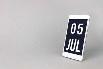 July 5th. Day 5 of month, Calendar date. Smartphone with calendar day, calendar display on your smartphone. Summer month, day of the year concept.