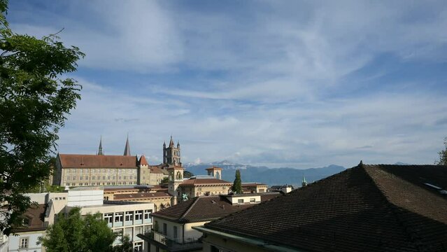 City of Lausanne. Time lapse of Lausanne cathedral Notre dame and Palais de Rumine. Historical monument. Lausanne, Switzerland.