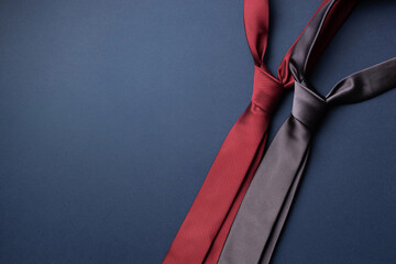 Red and Gray neckties on dark blue background. Father's day card. - obrazy, fototapety, plakaty