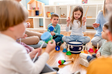 Preschool children with instruments on a music class