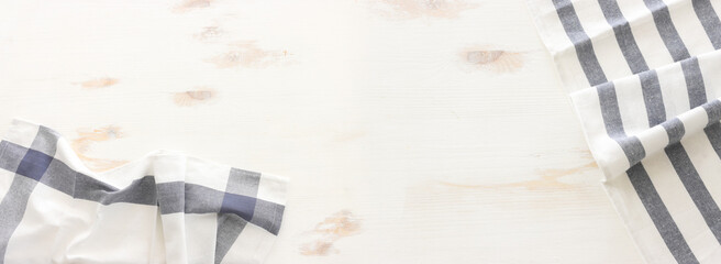 top view of vintage tablecloth with over white wooden background