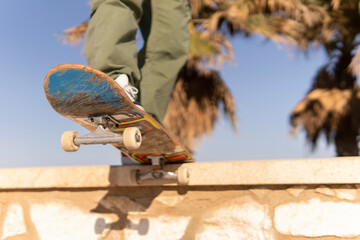 Young adult doing skateboard trick horizontal photo