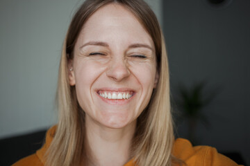 A girl laughing on camera