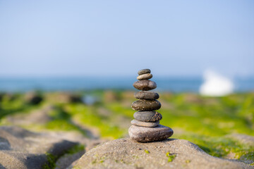 Zen stones on the beach in Laomei Green Reef