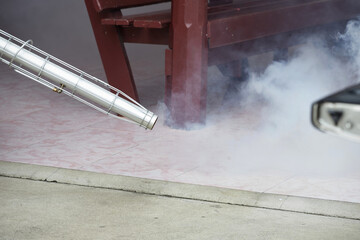A worker using fumigation mosquitoes machine for kill mosquito