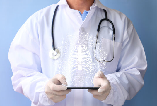 Doctor examines the bone hologram. Trauma, rheumatologist consultation, skeletal image, medical concept, future medical technologies