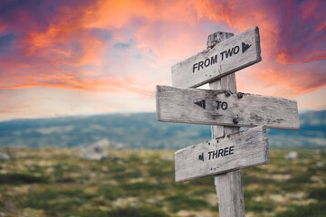from two to three text quote caption on wooden signpost outdoors in nature. Stock sign words theme.