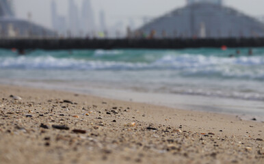 Close-up of a sandy beach in Dubai, partially out of focus