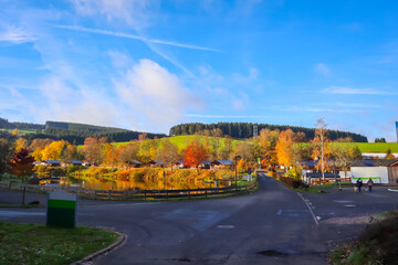 Obraz premium Landscape of Landal Wirfttal during autumn with forest and intersection. Bright autumn colors
