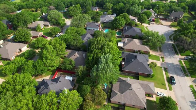 Aerial footage of a neighborhood in Keller Texas south of the KYA fields. Drone is flying north.