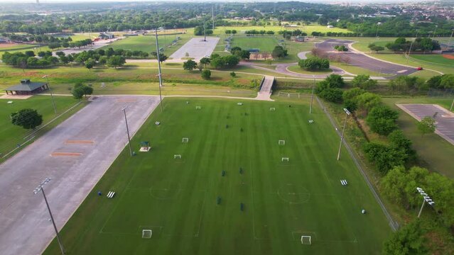 Aerial flight over KYA (Keller Youth Associate) sports complex.  Located in Keller Texas this is a sport field for soccer and baseball. Camera flies over soccer field.
