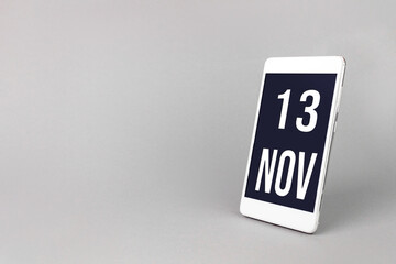 November 13rd. Day 13 of month, Calendar date. Smartphone with calendar day, calendar display on your smartphone. Autumn month, day of the year concept.