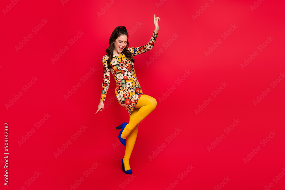 Sticker Full length body size view of attractive carefree cheerful girl dancing having fun isolated over vivid red color background