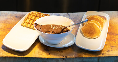 pancakes with chocolate cream in the kitchen