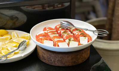tomatoes with cheese in the kitchen
