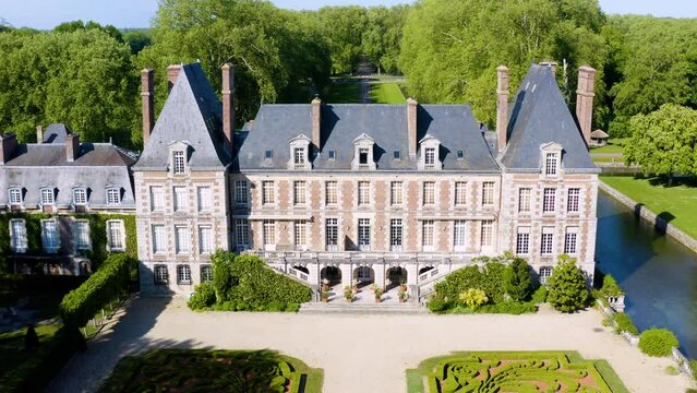 Aerial View Shot of Castle. Ch&acirc;teau de Courances (Domaine de Courances). French castle. drone aerial view with landscaped gardens and the surrounding area. 