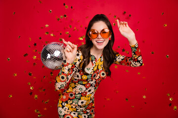 Portrait of attractive trendy girl holding disco ball dancing old school having fun isolated over...