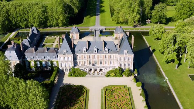 Aerial View Shot of Castle. Ch&acirc;teau. French castle. drone aerial view with landscaped gardens. Royal French Renaissance Castle and Gardens.  Aerial view drone flight around of Old fairytale castle. 