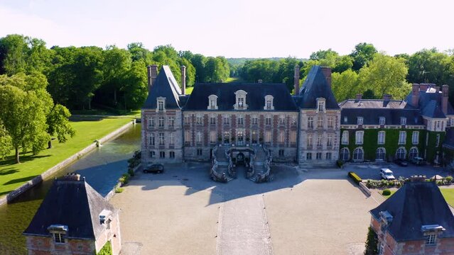 Aerial View Shot of Castle. Ch&acirc;teau. French castle. drone aerial view with landscaped gardens. Royal French Renaissance Castle and Gardens.  Aerial view drone flight around of Old fairytale castle. 