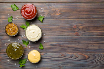 Many different sauces and herbs on table, flat lay top view. sauces with spices healthy concept