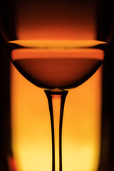 Cocktail drink on a colourful background. Orange hot drink. Selective focus.