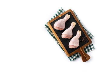 Raw chicken meat legs on cutting board isolated on white background	