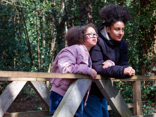Two girls on footbridge