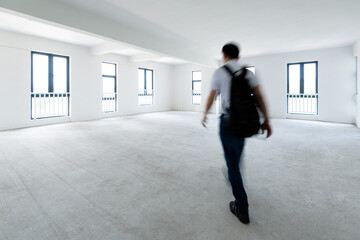 Obraz premium A man walking in empty office