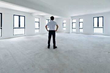 Fototapeta premium A man standing in empty office