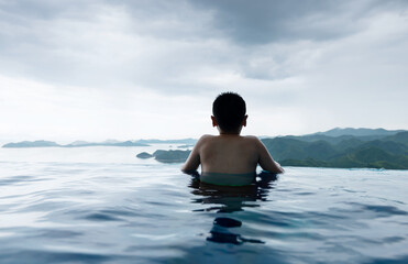 Fototapeta premium Boy swimming in the sea