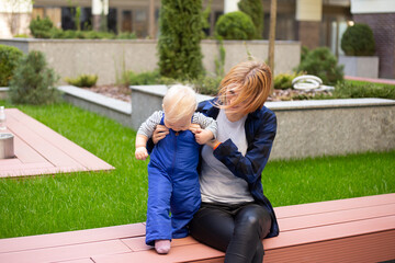 Woman in casual clothes outdoors on urban background