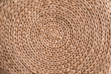 Abstract rattan texture. Background with round large straw fabric. textured water hyacinth background.