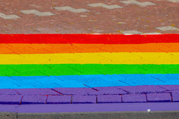 Colourful bricks footpath, Multicolor painted on outdoor path, Rainbow coloured on street, Symbol of gay, Lesbian, Bisexual and transgender, LGBT social movements, Abstract texture pattern background.