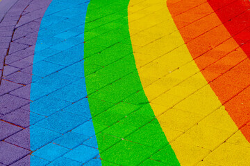 Colourful bricks footpath, Multicolor painted on outdoor path, Rainbow coloured on street, Symbol of gay, Lesbian, Bisexual and transgender, LGBT social movements, Abstract texture pattern background.