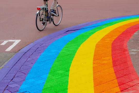 Colourful bricks footpath, Multicolor painted on outdoor path, Rainbow coloured on street with bicycle, Symbol of gay, Lesbian, Bisexual and transgender, LGBT social movements, Abstract background.