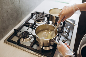 Woman confectioners prepare dessert in a professional kitchen