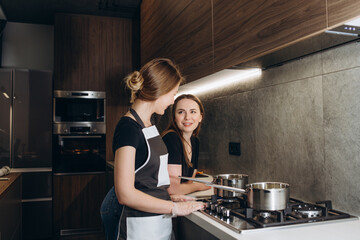 Fototapeta na wymiar Woman confectioners prepare dessert in a professional kitchen