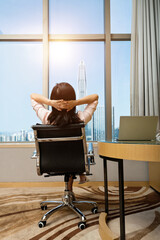 Woman sitting in front of the window