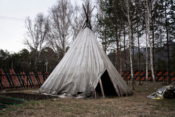 Traditional Indian wigwam in the forest among the trees.Traditional Indian wigwam in the forest among the trees. Indian tents at a campsite © diy13