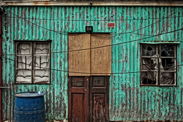 Fototapeta na wymiar old wooden door in a rusted house