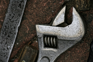 a rusted spanner on the ground