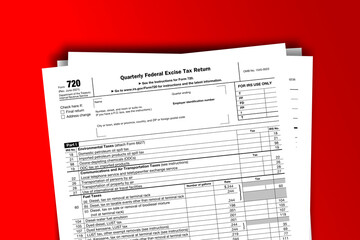 Form 720 documentation published IRS USA 04.26.2021. American tax document on colored