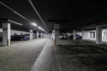 new underground parking with lighting and cobblestones
