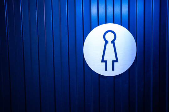 Pointer on a blue bright background Toilet for women.